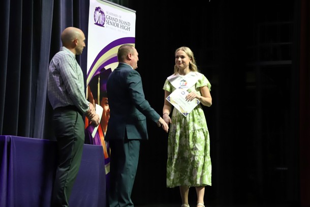 Addysen Waind, GISH Senior, receives her High Honors stole and certificate from Mr. Calvin Hubbard